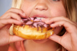 The government has pledged to introduce tight restrictions on junk food advertising to children