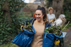 Mental Health Awarenerss Week tips for building community connections include getting outside, such as helping at a community garden